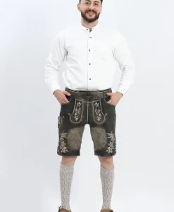 Lederhosen Men in Charcoal Black with Traditional Embroidery. Model is wearing White Traditional Shirt with Bavarian Socks and Shoes.