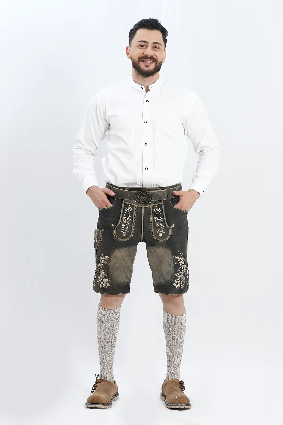 Lederhosen Men in Charcoal Black with Traditional Embroidery. Model is wearing White Traditional Shirt with Bavarian Socks and Shoes.