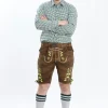 Lederhosen Men in Brown Color with Traditional Green Embroidery. Model is wearing checkered green shirt and Traditional Bavarian Shoes.