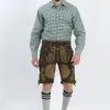 Lederhosen Men in Dark Brown Color with Traditional Embroidery. Model is wearing Green Checkered Traditional Shirt with Bavarian Socks and Shoes.