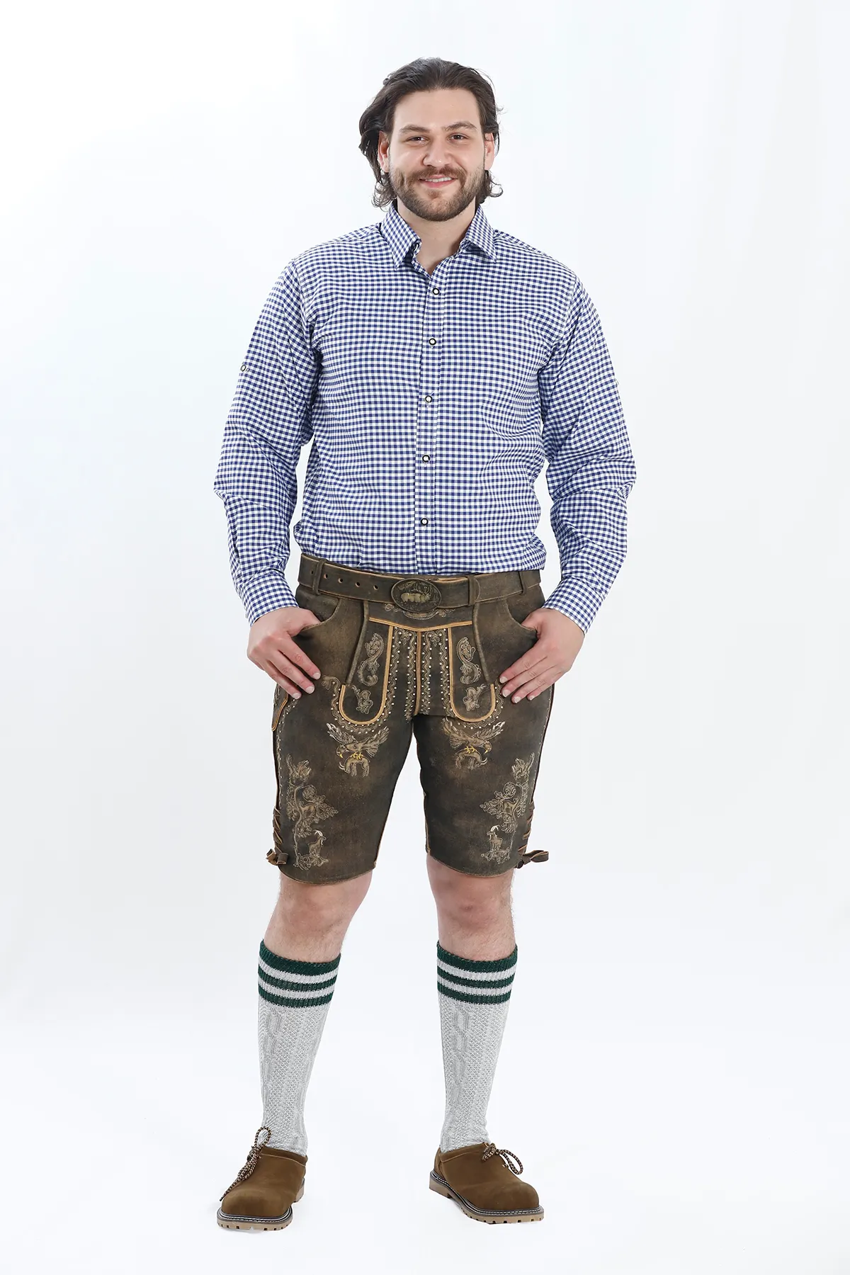 Lederhosen Men in Brown Color with Traditional Embroidery. Model is wearing Blue Checkered shirt and Traditional Bavarian Shoes.